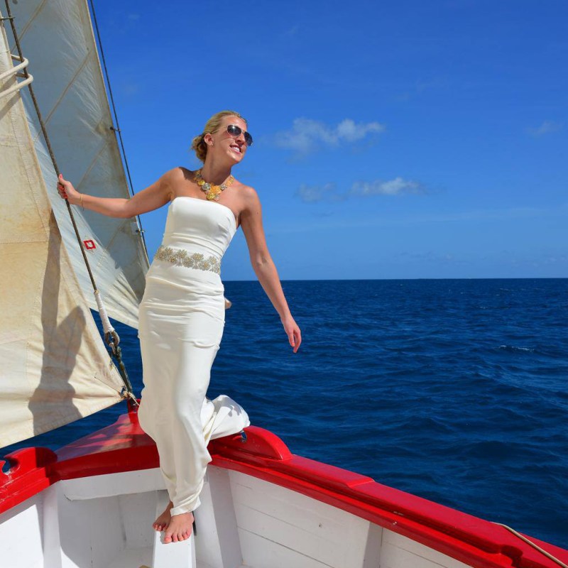 a man standing next to a body of water