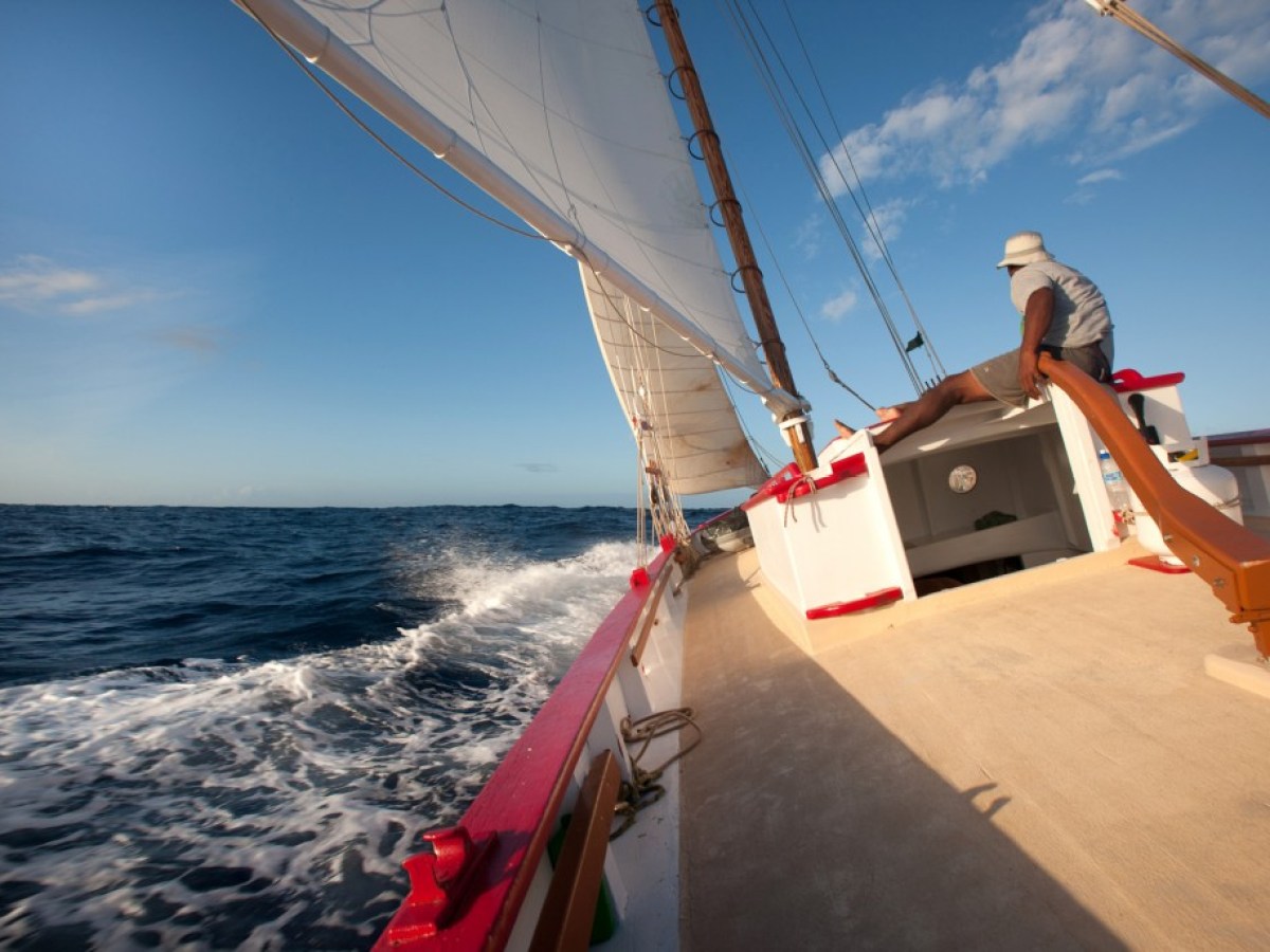 a man riding on the back of a boat