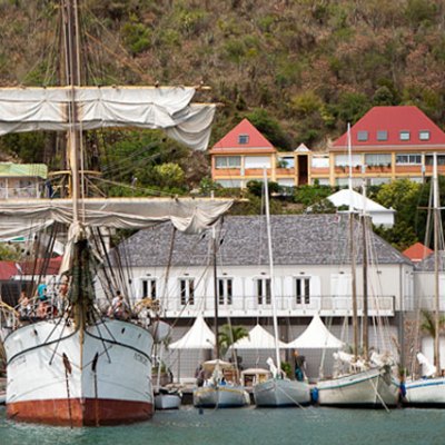 a boat is docked next to a body of water